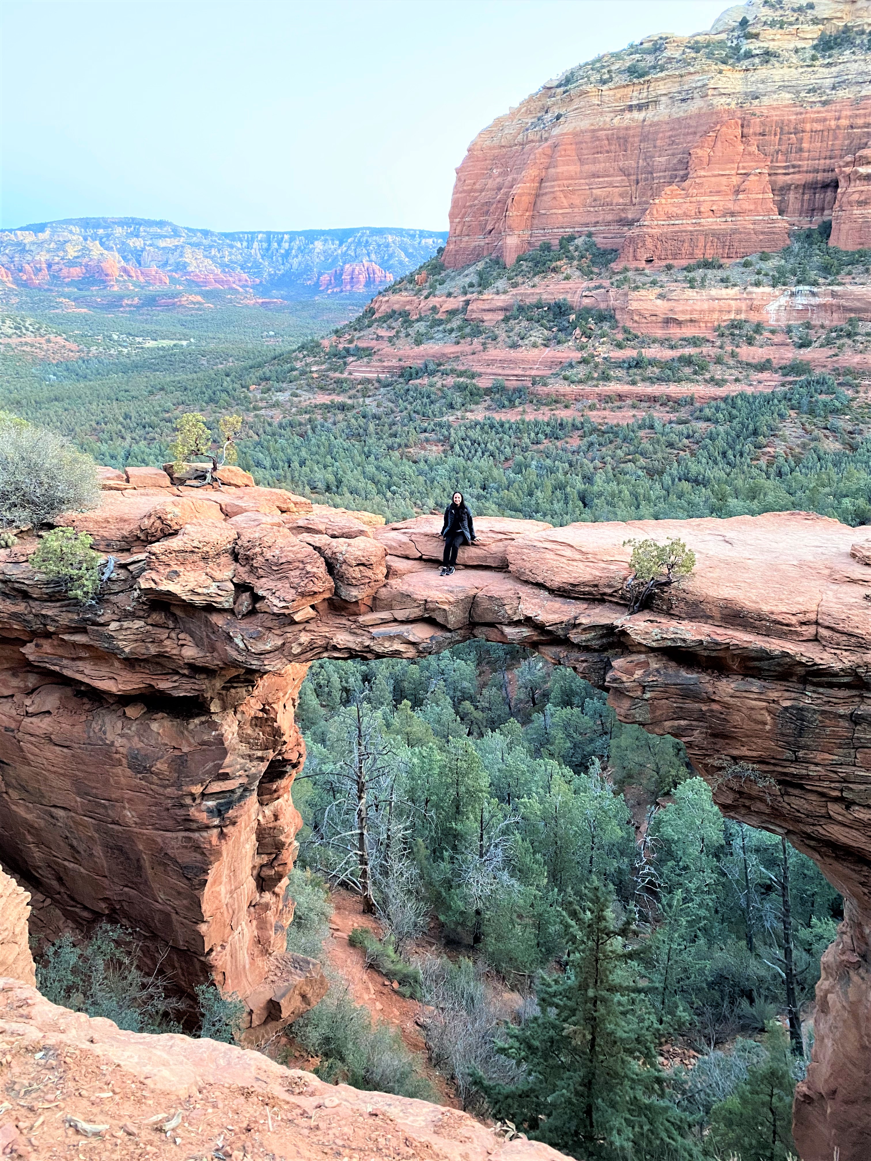 Woman Sitting on Devil's Bridge in Sedona AZ