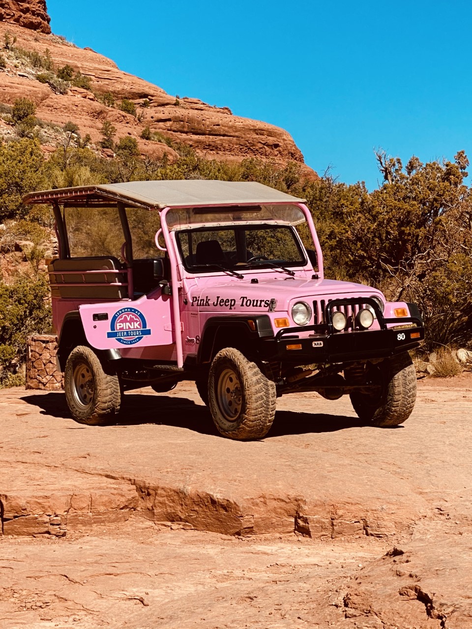 A Pink Jeep Wrangler in the Red Rocks