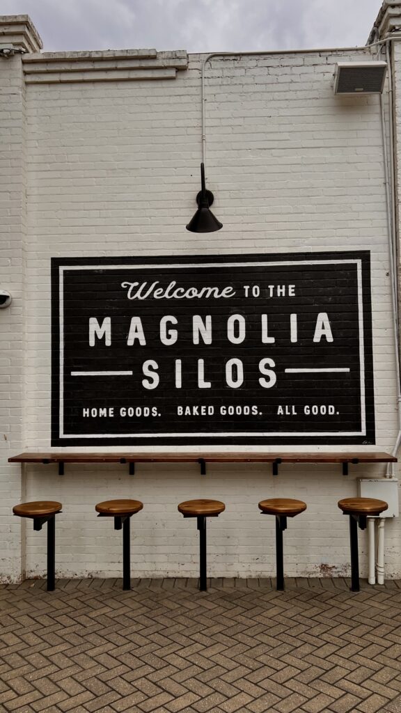 a welcome sign for the Magnolia Silos property 