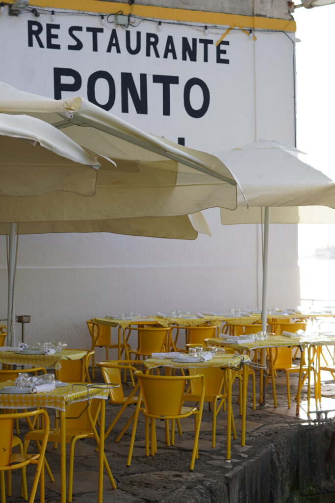 chairs and tables of a restaurant near the water