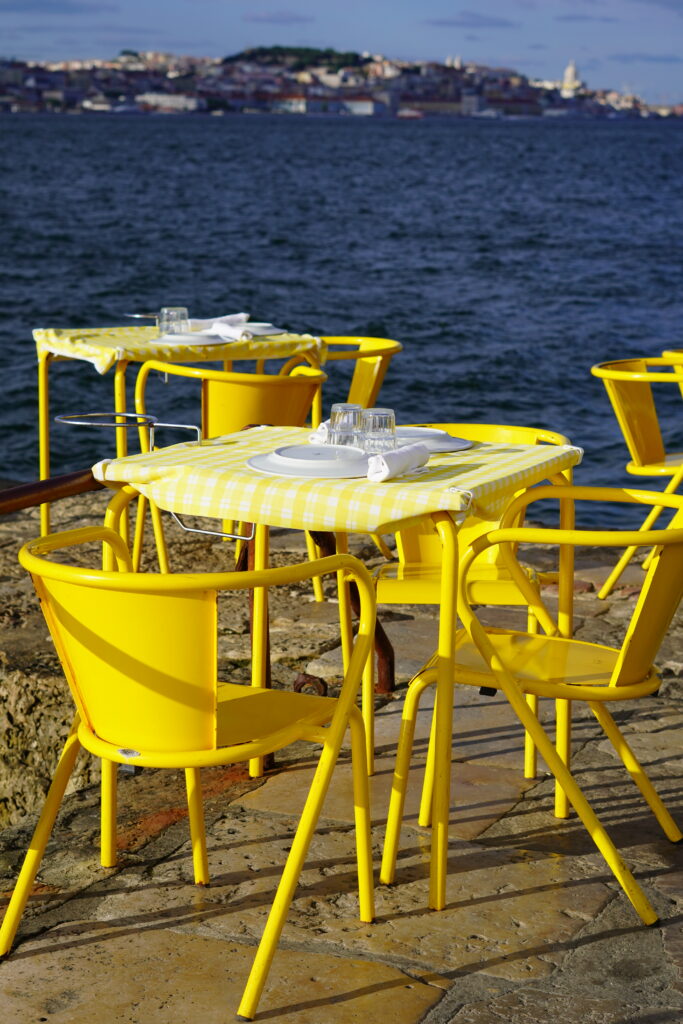 chairs and tables of a restaurant near the water