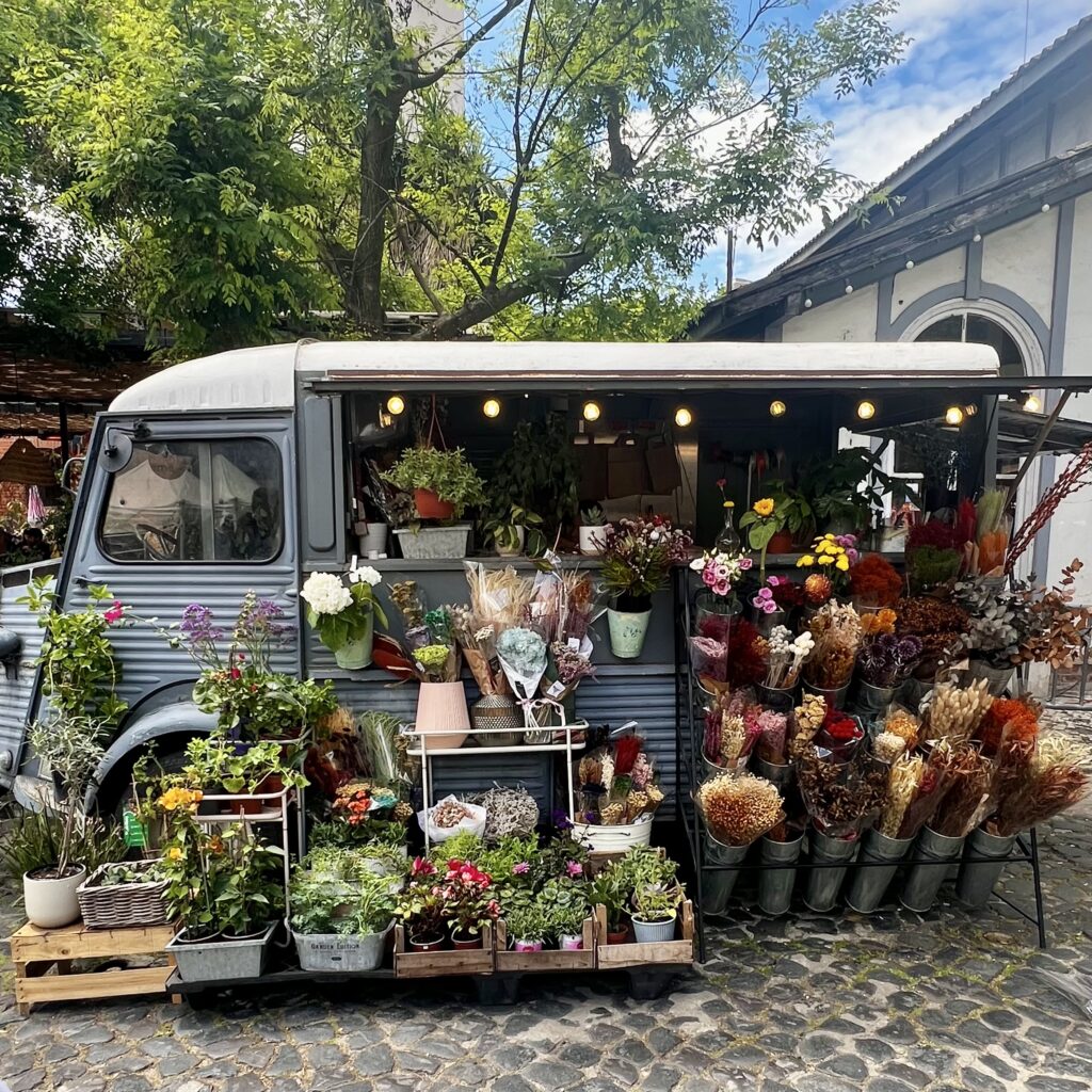 a display of flowers on a flower truck 