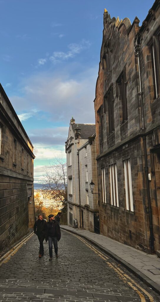 two men walking in an alley