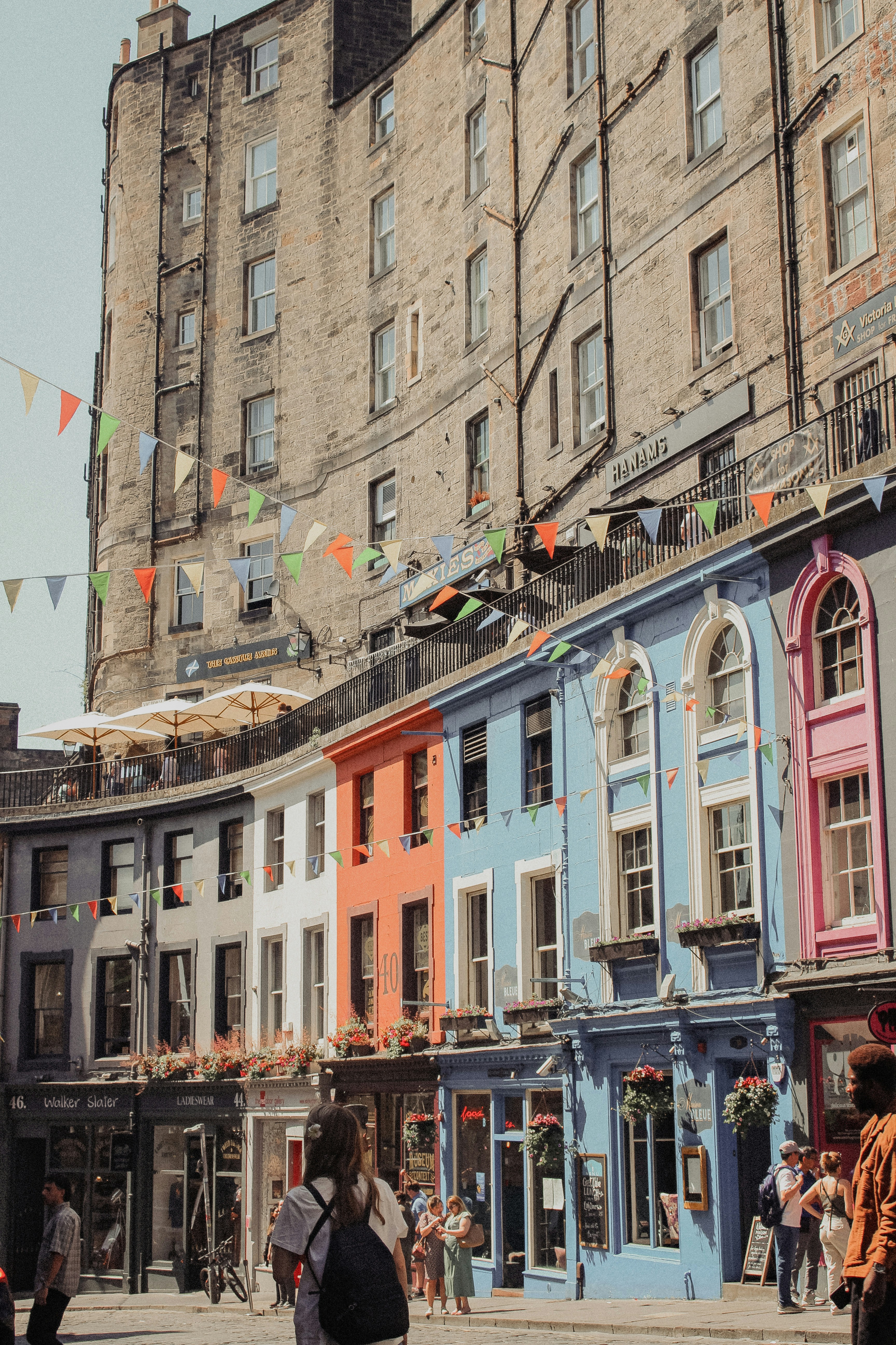 a street with colorful shop doors